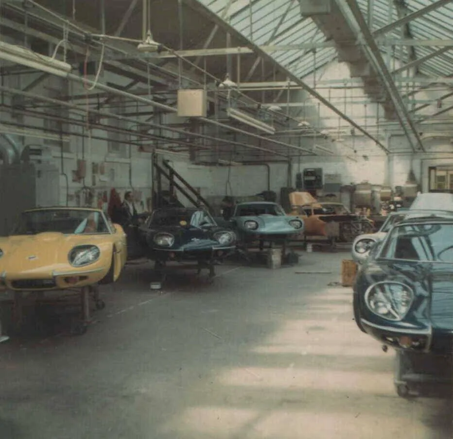 The Marcos factory floor in the 1960s, with GT coupés in mid-assembly